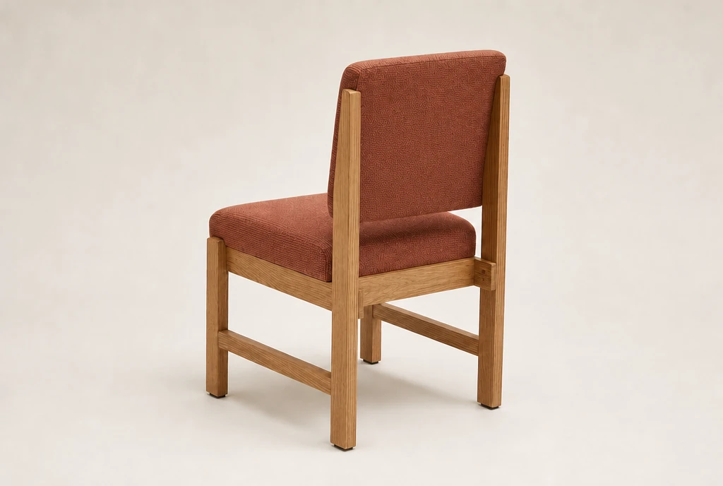 Natural medium-oak hardwood church chair concept with muted rust-red woven fabric and no rear book rack
