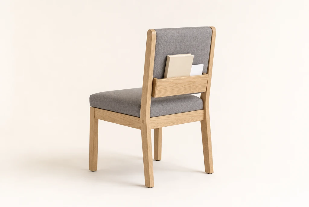 Light natural ash hardwood church chair concept with soft slate-gray woven fabric and a rear book rack