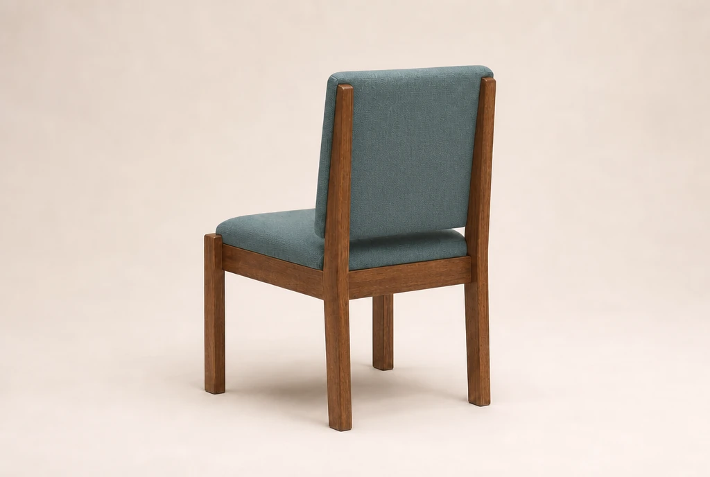 Medium pecan-brown hardwood church chair concept with muted blue-green woven fabric and no rear book rack